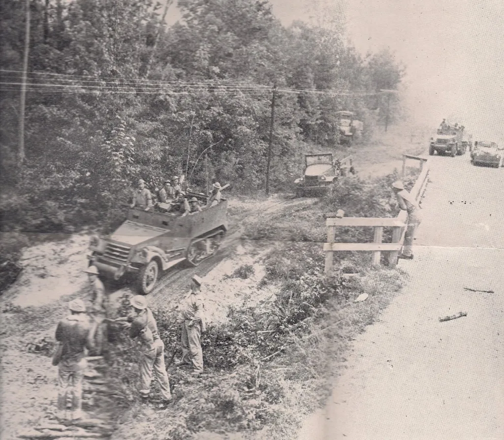 Tanks crossing and fording Kib Bayou/Kisatchie Bayou in the Peason Community during the maneuvers. This site is located on La. Hwy. 118 and is still visible. (Robertson Collection)