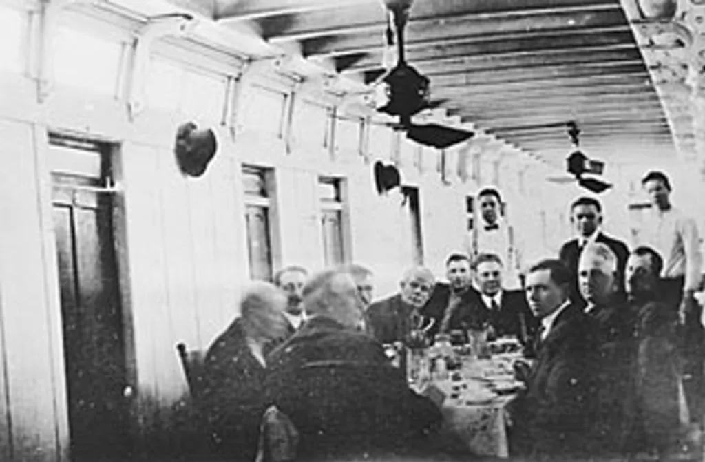 Inside the Harry Lee, men sitting around a table eating. Photo from University of Wisconsin-LeCrosse