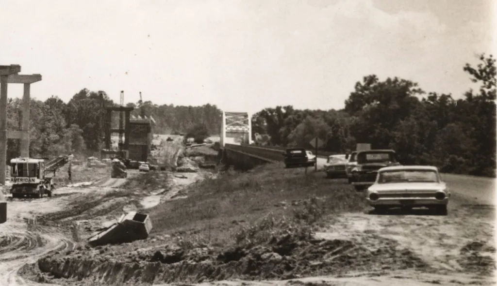 Old Pendleton Gaines bridge can be seen next to beams for the new bridge