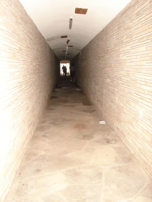 Connecting Tunnel, House Island. Looking west, toward boat landing. This stonework-constructed gently sloping tunnel connecting the House Island boat landing with the bottom level of the Hodges residence. Photo from the Exploring Hodges Gardens website.