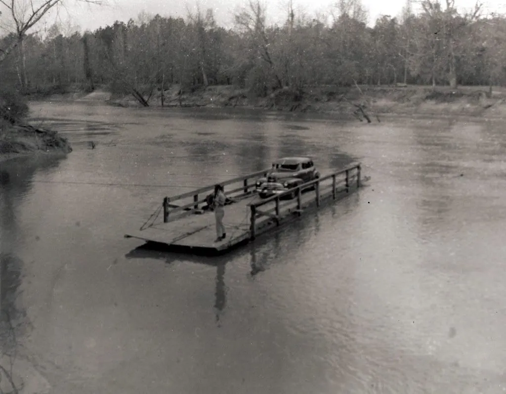 From the photo collection of D. T. Kent, this was taken near Kirbyville, Texas (Jasper County).  I believe it is on the Neches River, however, not the Sabine, though I do not k know for sure.  A reader had suggested it was Sheffield Ferry.  Kent&#x27;s collection does contain some photos on or around the Sabine.  