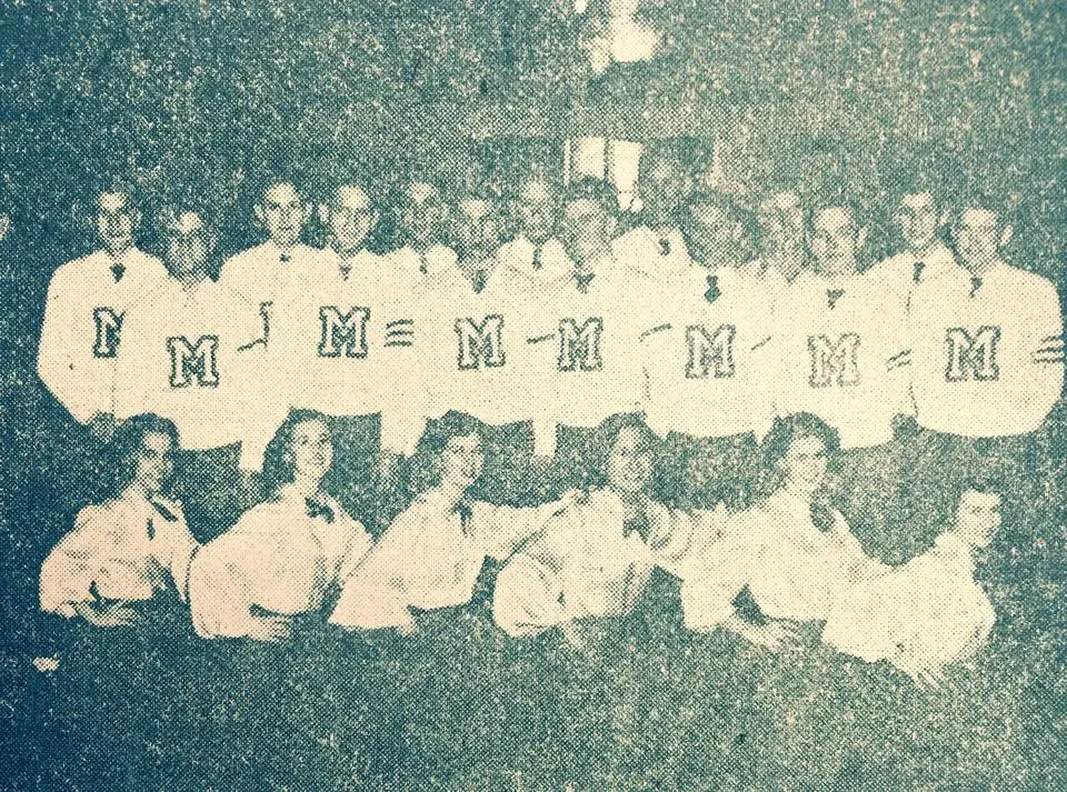 Photograph from the Facebook post “Many football and cheerleaders 1951.”