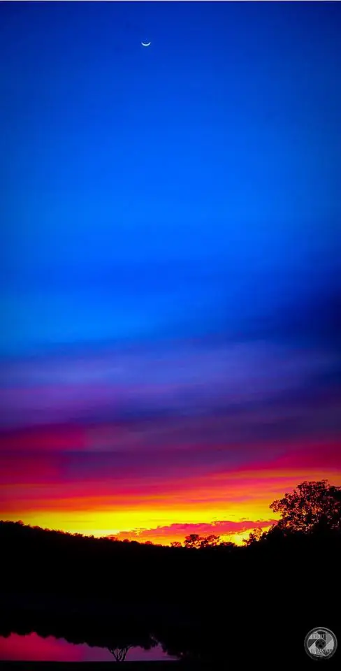 Photograph from the Facebook post “Sun sets as moon rises, at Hodges.”