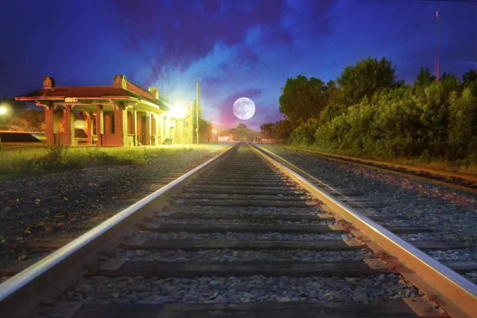 Photograph from the Facebook post “Moonrise night before last over the railroad track at Many Train Depot.”