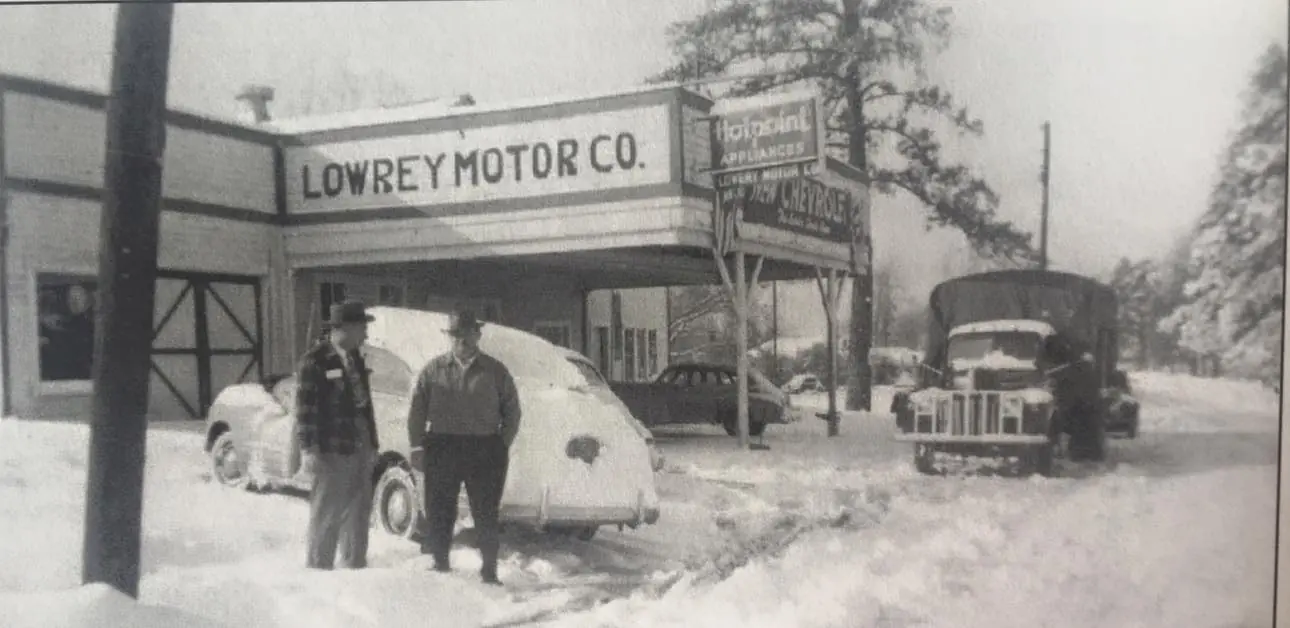 Photograph from the Facebook post “The first home of Lowrey Chevrolet shown during a snowfall in 1949.”