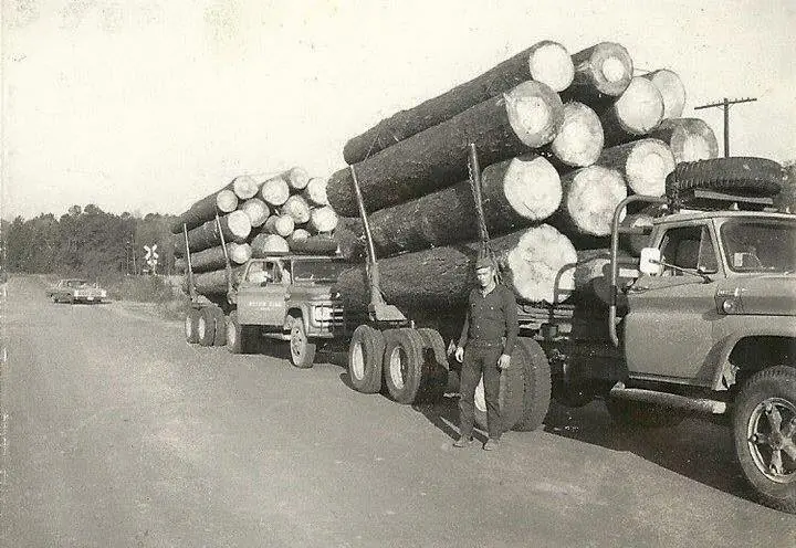 Photograph from the Facebook post “Jerry Slaughter shown with loaded log truck.”