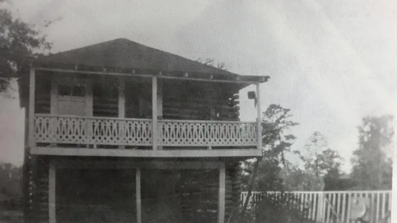 Photograph from the Facebook post “Two story log cabin built by Dillon Peterson.”