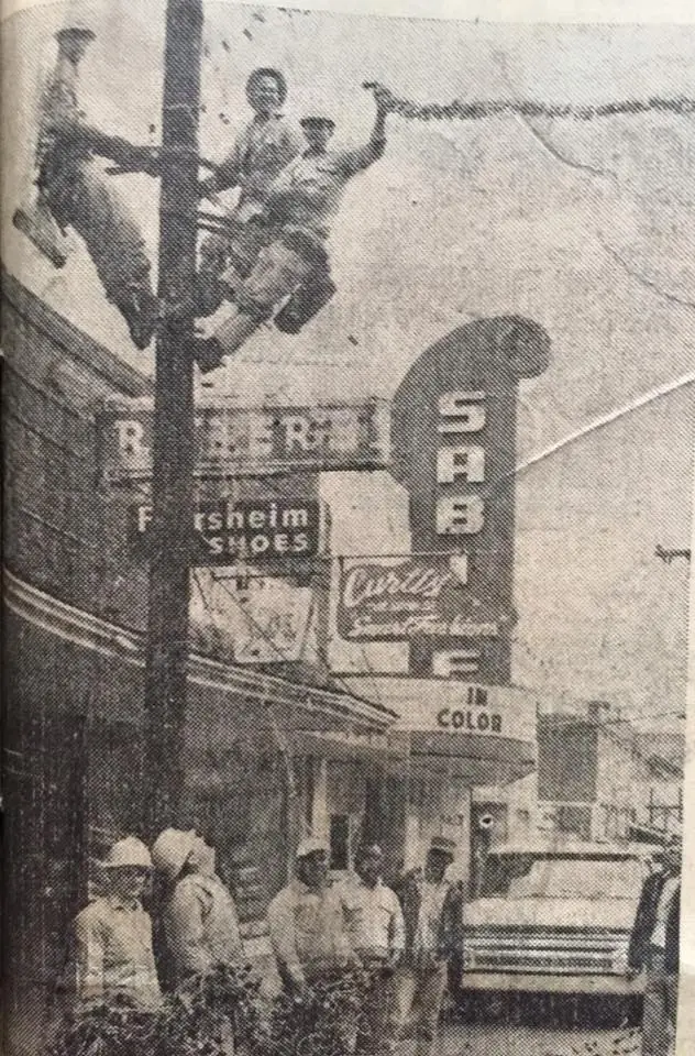 Photograph from the Facebook post “Cleco helping put Christmas lights up in Many in 1967.”