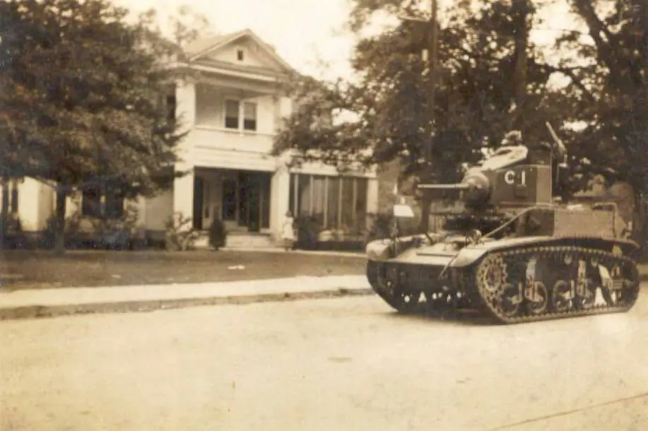 Photograph from the Facebook post “September 09, Digital image of a military tank on Pine Street in DeRidder during the…”