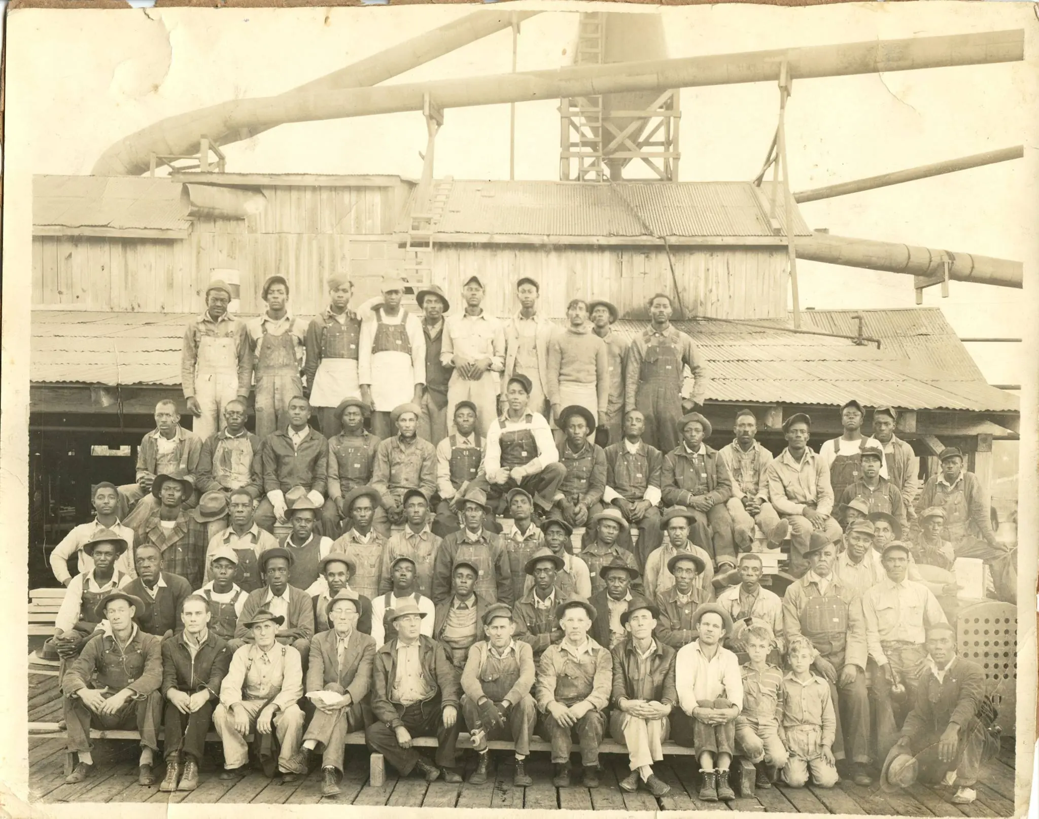 Photograph from the Facebook post “Employees I believe of the Louisiana Long Leaf Lumber Company at Fisher, Louisiana.”