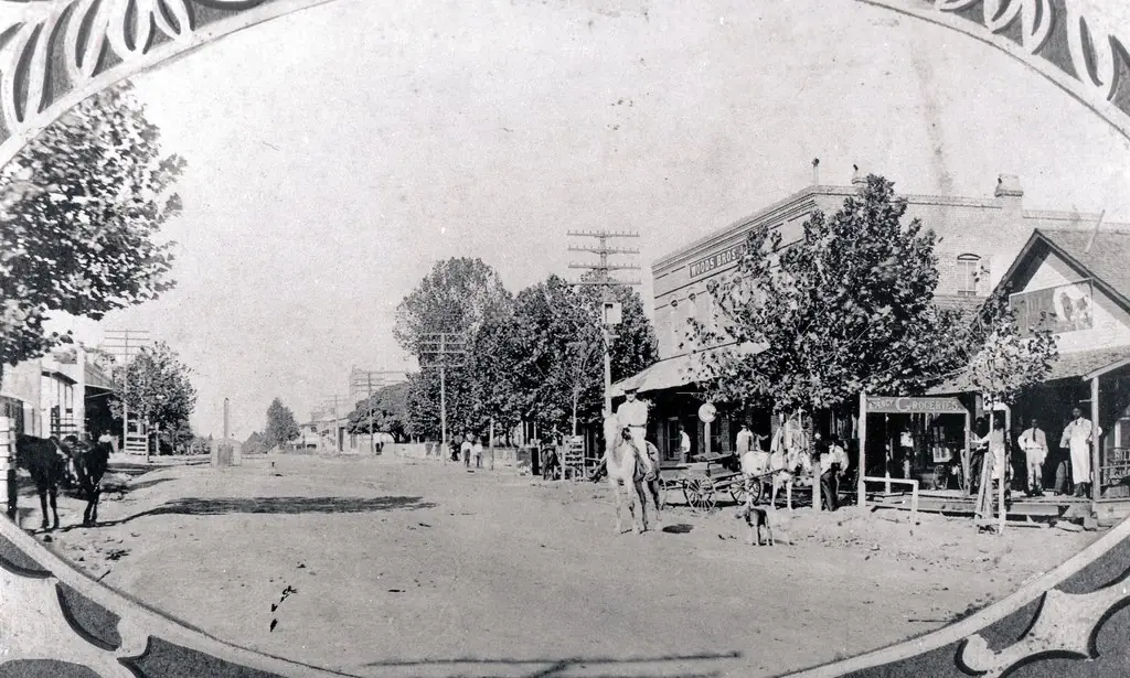 Photograph from the Facebook post “Main Street Looking West Cooper's Cafe and Woods store on right From the collection of Mr.”