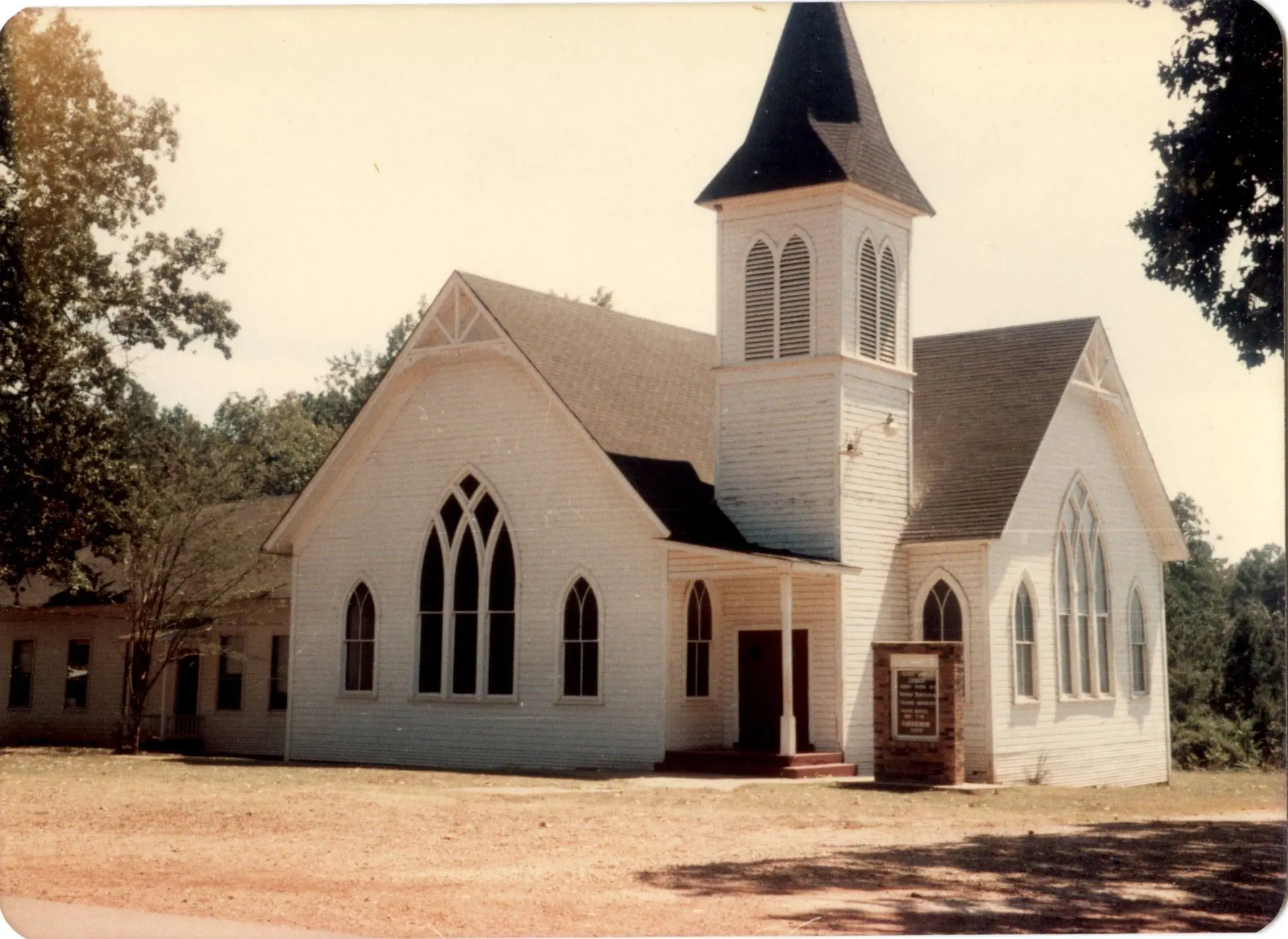 Photograph from the Facebook post “Fisher Baptist Church in Fisher, Louisiana, when it was on Main Street, just before you…”