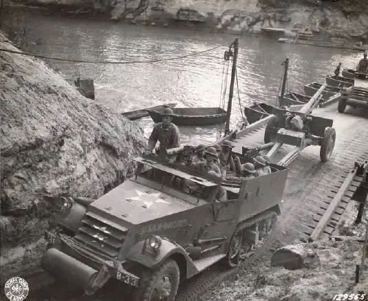 Photograph from the Facebook post “Soldiers in a jeep driving over a short bridge in Beauregard Parish during the Louisiana…”