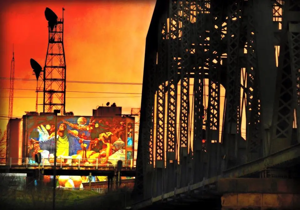Photograph from the Facebook post “Texas Street Bridge in Shreveport and a very colorful billboard.”