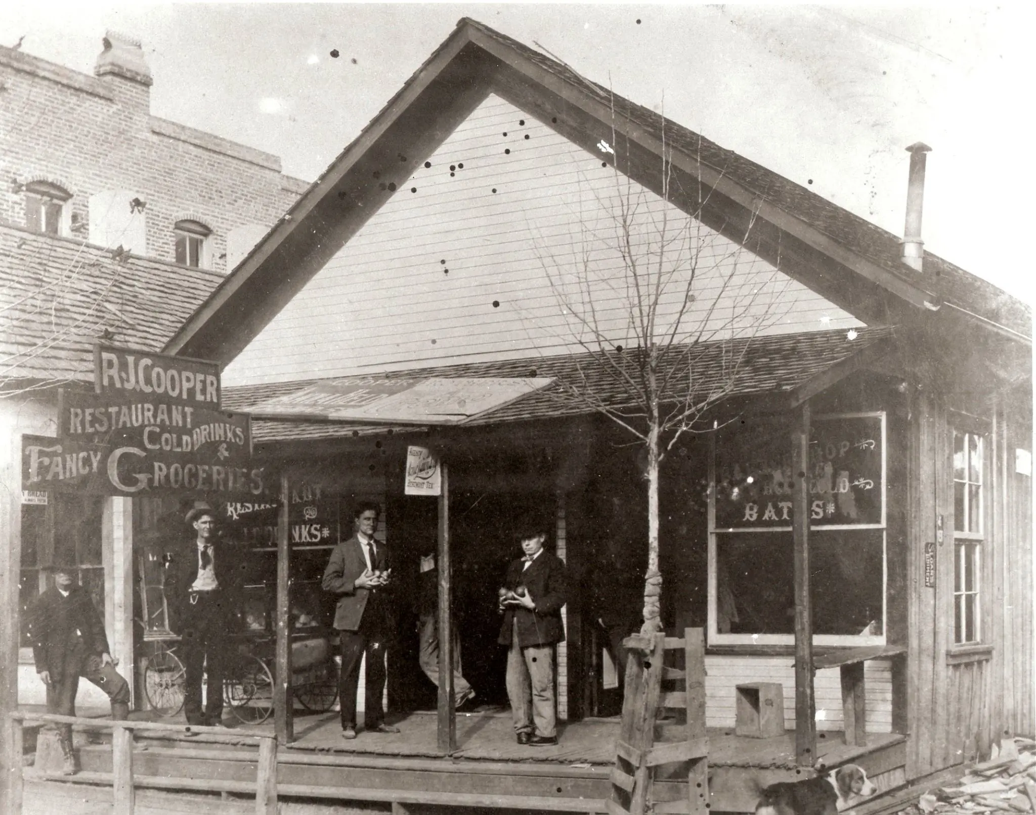Photograph from the Facebook post “Kirbyville Cooper's Cafe (left) and barber shop (right).”
