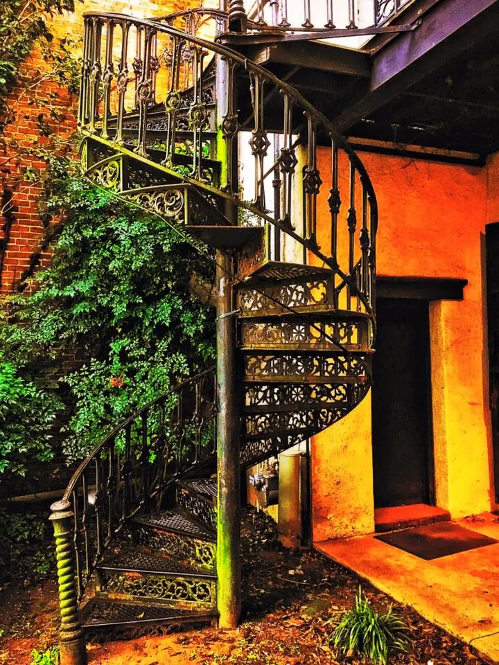 Photograph from the Facebook post “Winding iron stairs in an alley behind Plantation Treasures in Downtown Natchitoches.”