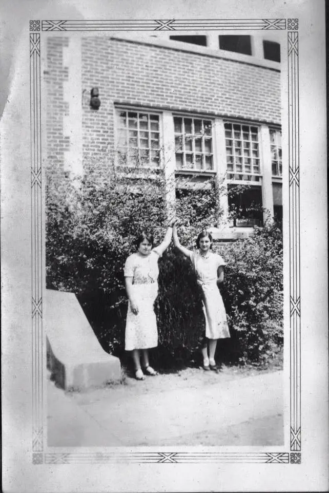 Photograph from the Facebook post “Helen Jackson on left in front of Many High School.”