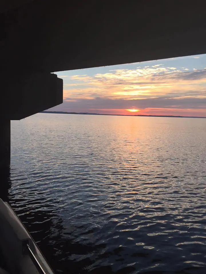 Photograph from the Facebook post “Shared by Darett Brittain, Sun setting under Pendleton Bridge this evening...”