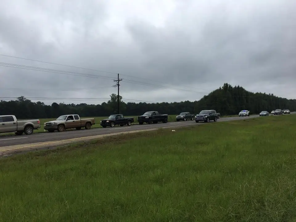 Photograph from the Facebook post “Shared by a reader, trucks line Hwy.”