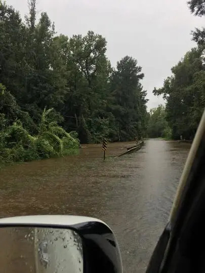 Photograph from the Facebook post “First pic: Mill Creek on Cenchrea Road in Florien about 4hrs ago.”
