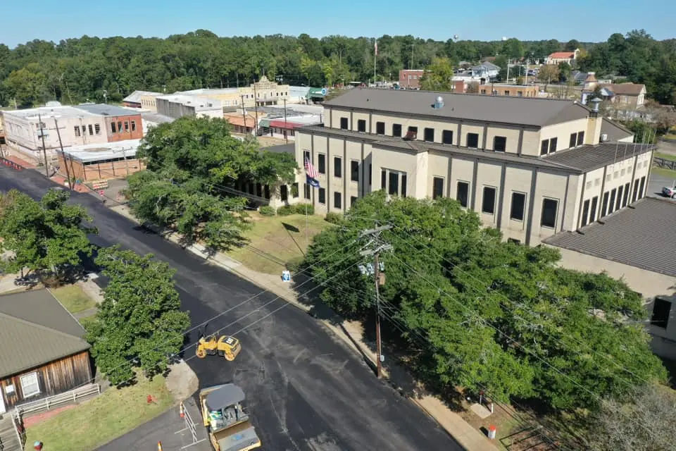 Photograph from the Facebook post “Road overlay construction on Capitol Street in Many today, leaving difficult access to…”