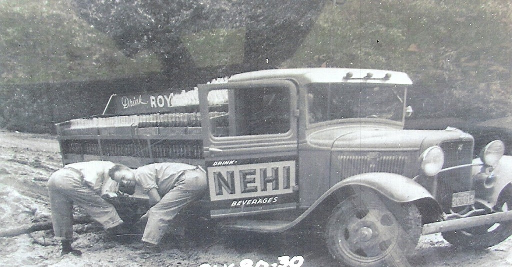 Delivery truck from the Many Nehi Bottling Company stuck in the mud while trying to deliver cold drinks to the rural stores in the Mount Carmel and Peason areas. Readers may be able to identify the two men in the picture who worked for Nehi. (Robertson Collection)